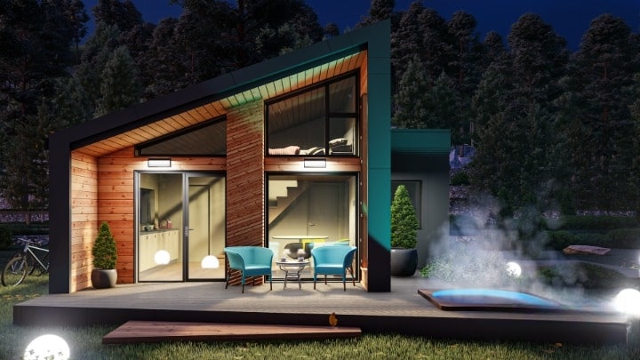 Casă A-Frame din panouri SIP amplasată la munte, cu vedere panoramică și terasă din lemn