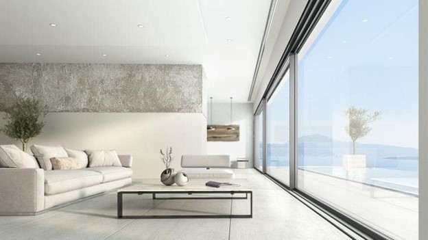 Ferestre din aluminiu minimaliste ALUMIL SUPREME S650 PHOS, cu suprafețe vitrate ample într-un living modern